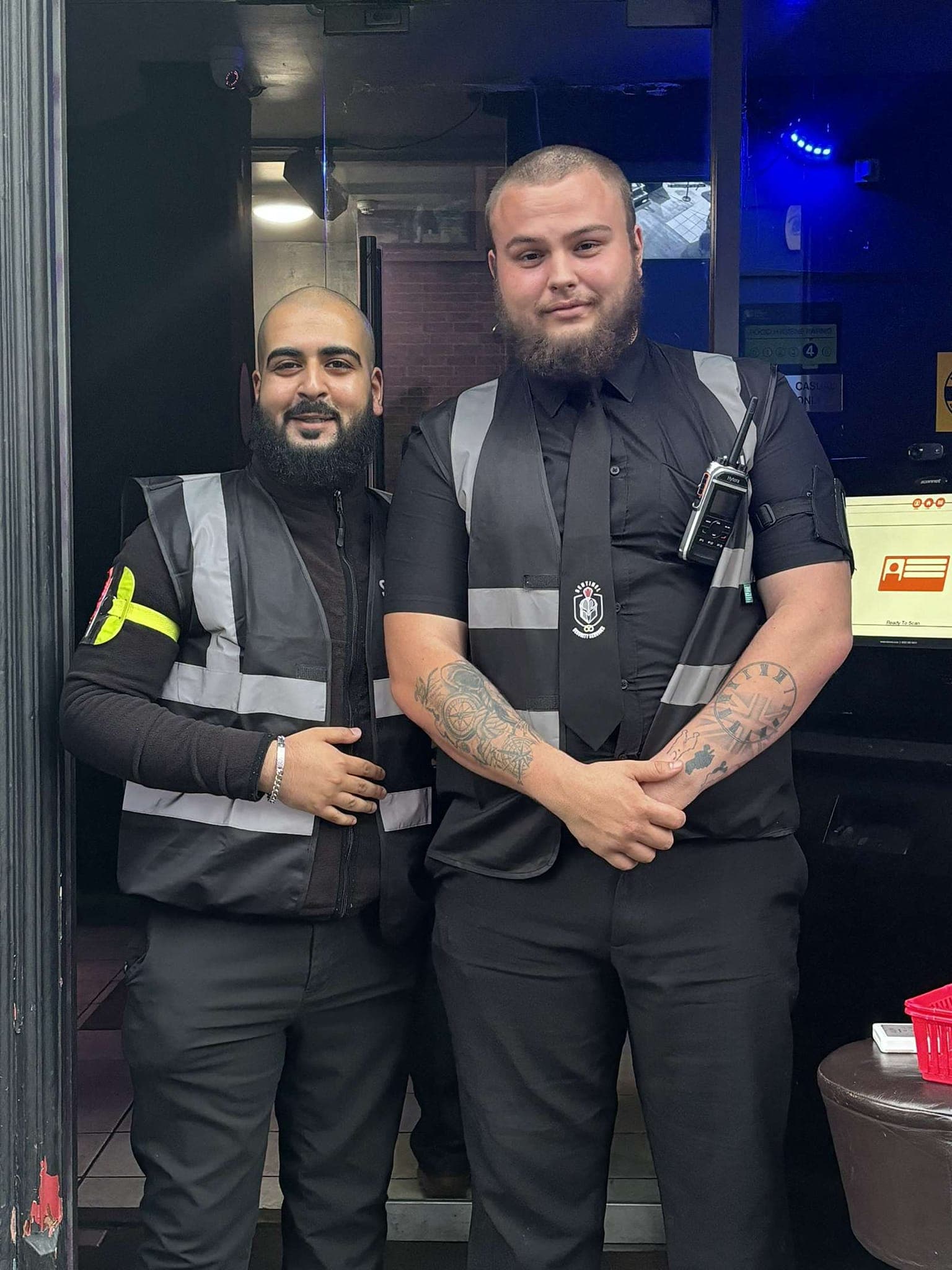 Two Sentinel door supervisors inside a venue